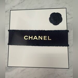 CHANEL Beauty Logo Box with Navy and Gold Ribbon.